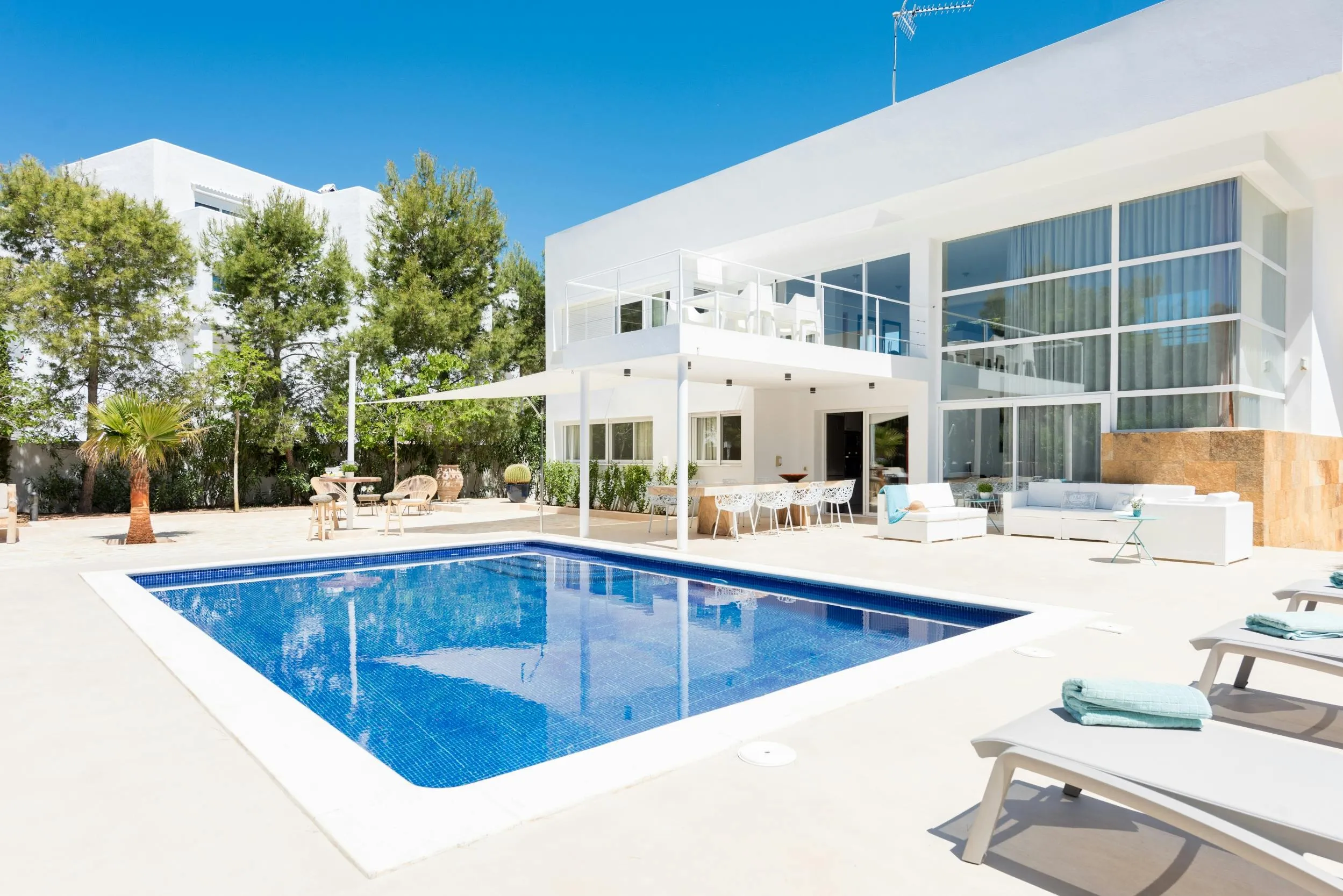 Modern villa with large windows and a private pool