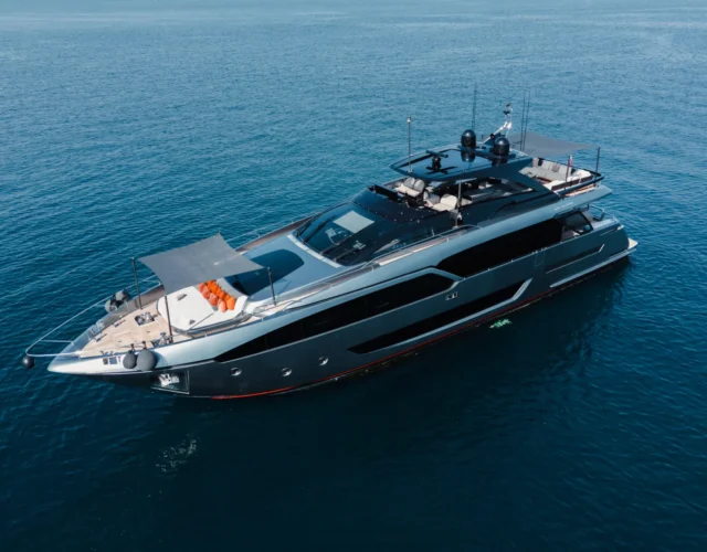 The Riva Argo 90 gliding through the waters near Ibiza, offering the ultimate luxury yacht charter experience.