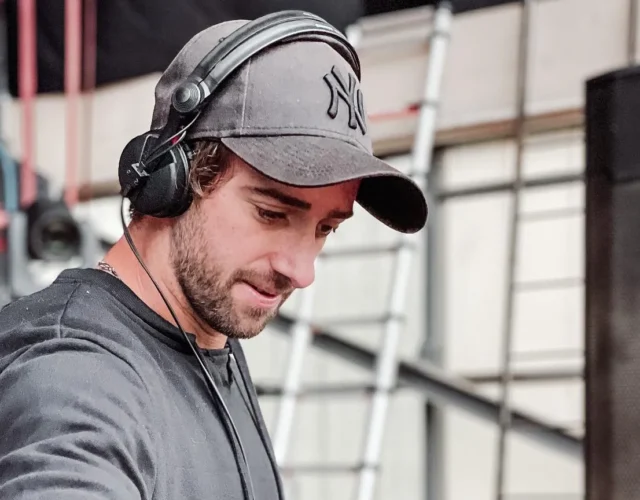 French DJ Julo plays during a party