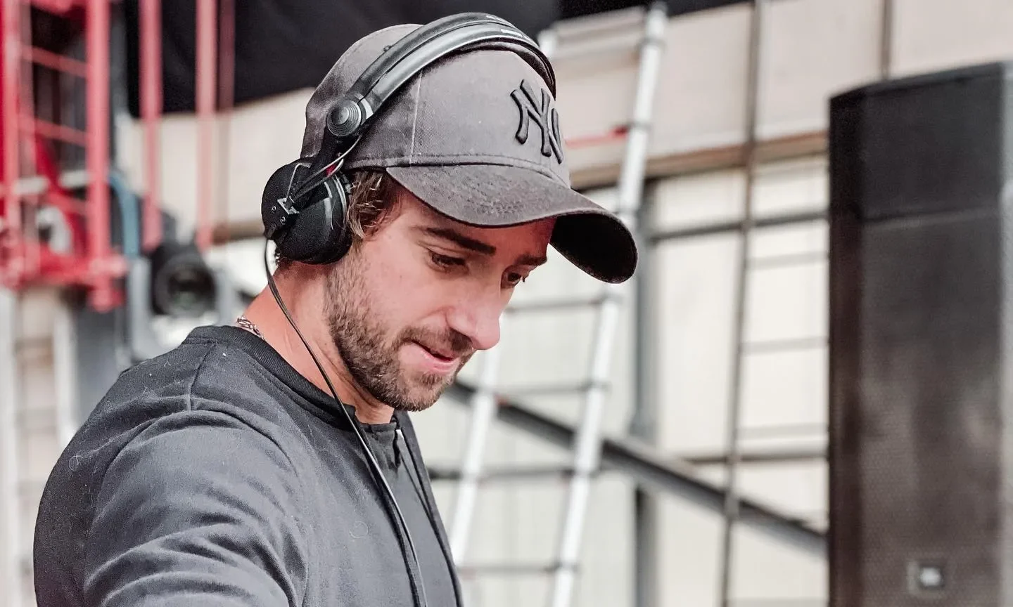 French DJ Julo plays during a party