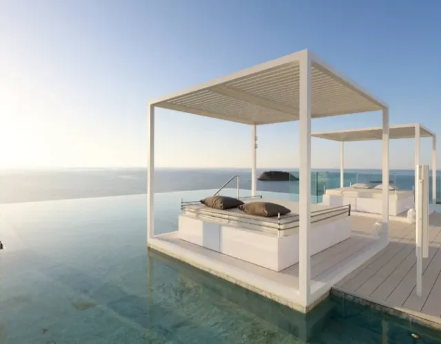 bali bed infront of infinity pool with cristal clear blue sky and seaview. Looks like in heaven!