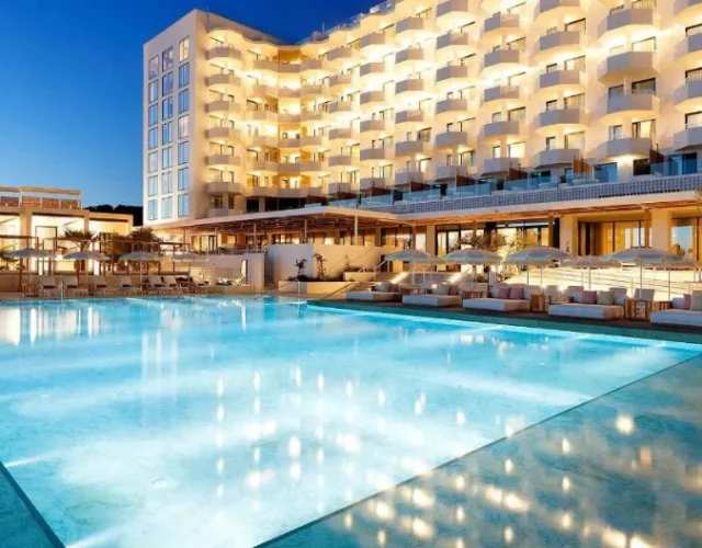 Beautiful lightened Hotel with pool in night sky